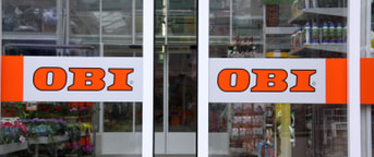 Eingangstüre OBI mit Logo Migros Zürich Eingangstüre OBI mit Logo Migros Zürich